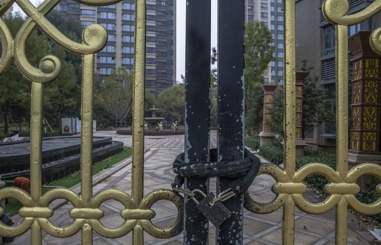 A locked entrance to an Evergrande residential project, apparently completed but never opened, in Taiyuan, China on Oct. 20, 2021. Amid reports that former top executives are being held by authorities, Evergrande’s troubles deepened on Sept. 28, 2023. when the company suspended trading in the stock of its three publicly traded companies in Hong Kong without giving a reason. (Gilles Sabrie / The New York Times) 