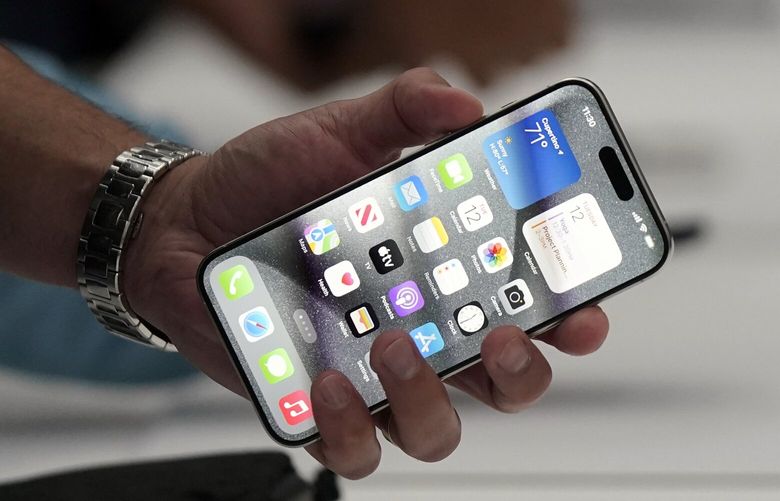 The iPhone 15 Pro is shown after its introduction on the Apple campus, Tuesday, Sept. 12, 2023, in Cupertino, Calif. (AP Photo/Jeff Chiu) 