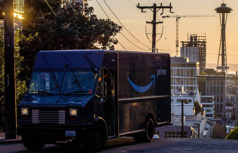 An Amazon Prime truck rounds the corner while on its delivery route along Bellevue Avenue in Capitol Hill of Thursday, April 22, 2021.