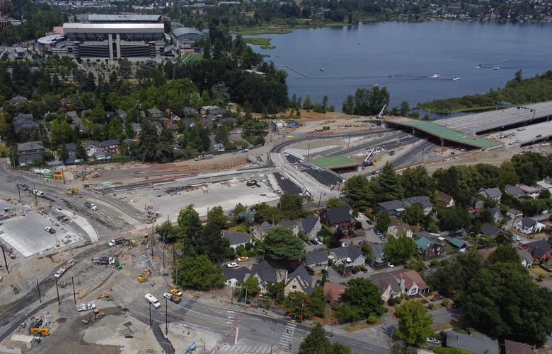 The massive 520 bridge lid project is seen from the air in this view looking north, Sunday, July 16, 2023 in Seattle. Montlake Boulevard, at left, which is closed until July 24, usually carries more than 60,000 drivers a day.