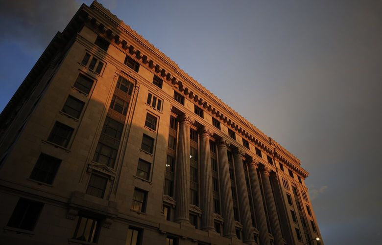 FILE – The sun sets on the Fulton County Courthouse, Monday, Aug. 14, 2023, in Atlanta. A bail bondsman charged alongside former President Donald Trump and 17 others has become the first defendant in the Georgia election interference case to accept a plea deal with prosecutors. Scott Hall pleaded guilty in court on Friday, Sept. 29, to five counts of conspiracy to commit intentional interference with performance of election duties, all misdemeanors. Prosecutors had accused him of participating in a breach of election equipment in rural Coffee County. (AP Photo/Alex Slitz, File) WX487 WX487