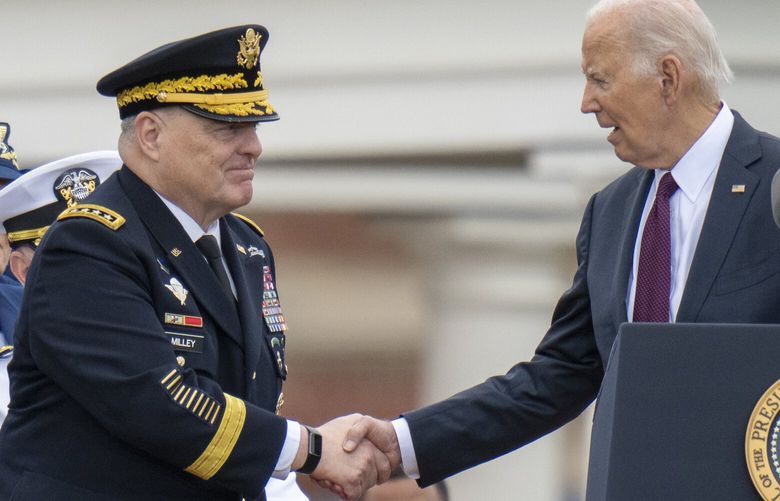 President Joe Biden, right, shakes hands with outgoing Joint Chiefs Chairman Gen. Mark Milley, during an Armed Forces Farewell Tribute in honor of Milley at Joint Base Myer–Henderson Hall, Friday, Sept. 29, 2023, in Fort Meyer, Va. Also held was an Armed Forces Hail in honor of Gen. CQ Brown, Jr., who the Senate confirmed as the next chairman of the Joint Chiefs of Staff. (AP Photo/Alex Brandon) VAAB115 VAAB115