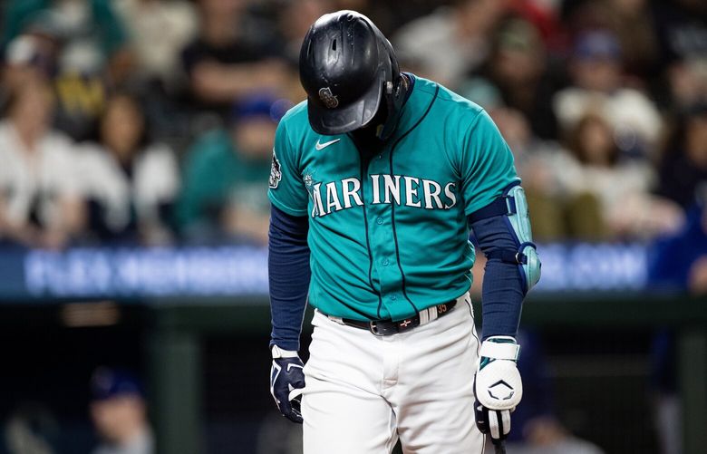 Mariners right fielder Teoscar Hernández walks off the field after striking out Saturday, Sept. 30, 2023, as the Seattle Mariners take on the Texas Rangers at T-Mobile Park in Seattle.