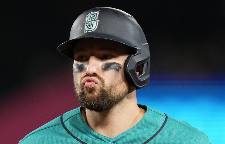 Seattle Mariners’ Cal Raleigh reacts after flying out against the Texas Rangers during the eighth inning of a baseball game, Saturday, Sept. 30, 2023, in Seattle. (AP Photo/Lindsey Wasson) WALW644 WALW644