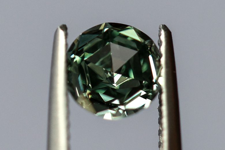 Polished diamonds with De Beers Group Industry Services grading