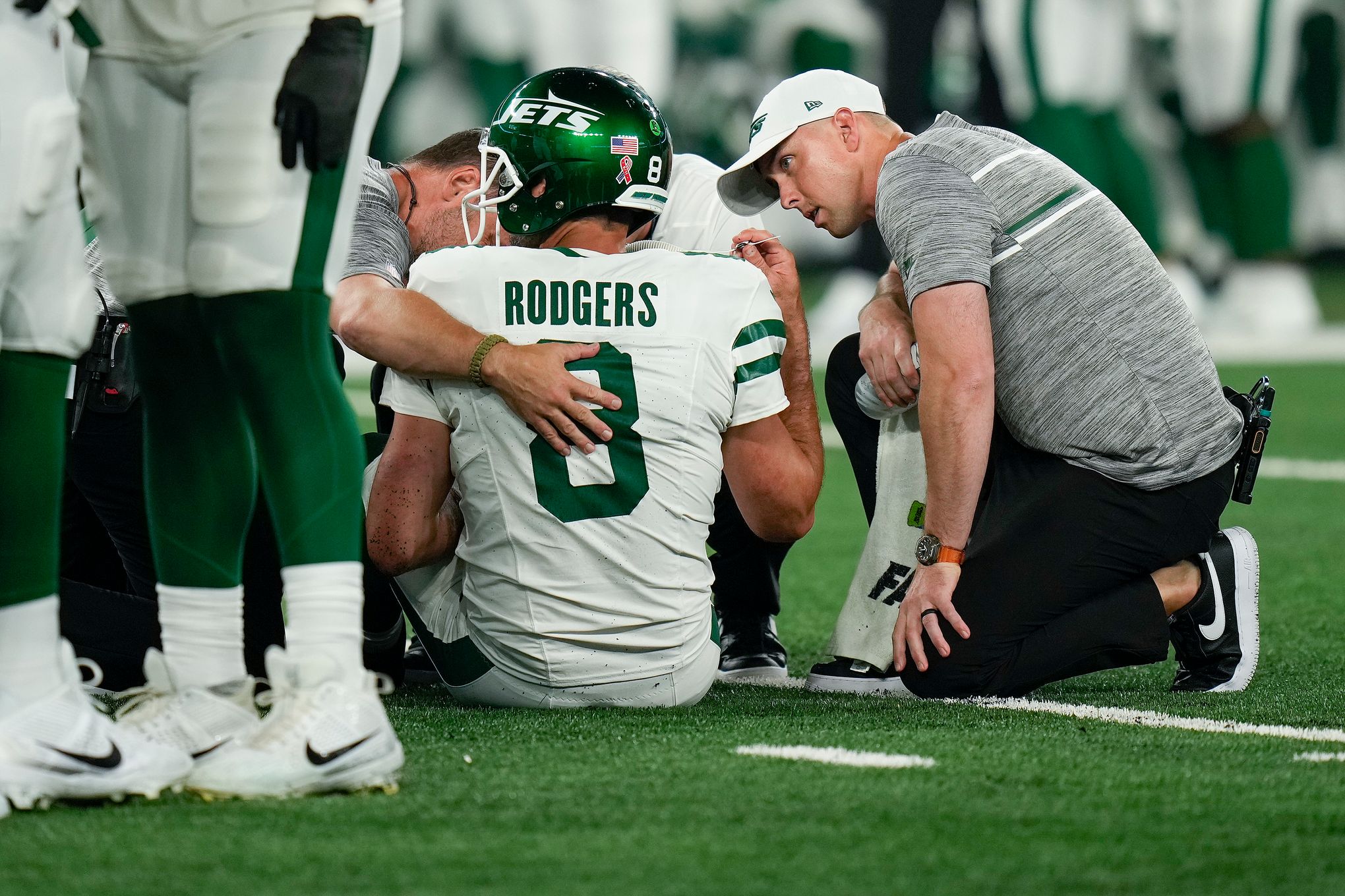 Aaron Rodgers injures his left Achilles tendon in his first series for the  Jets