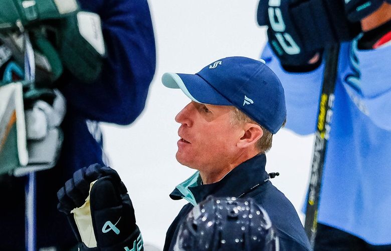 Coach Dave Hakstol gathers his team together to explain the next set of drills the first day of camp for the Seattle Kraken. The Seattle Kraken opened training camp for the fall campaign Thursday, Sept. 21, 2023 at the Community Iceplex at Northgate. 225014