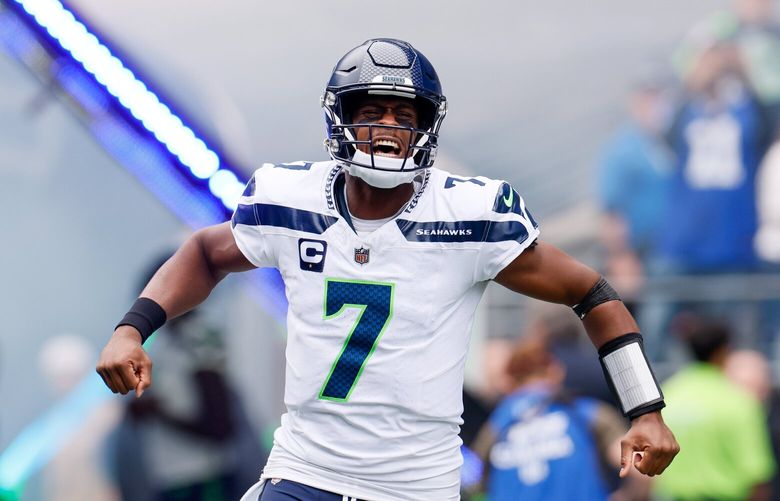 Seattle Seahawks quarterback Geno Smith yells out as he runs out of the tunnel before the start of a game against the Carolina Panthers Sunday, Sept. 24, 2023 in Seattle. 225054 225054