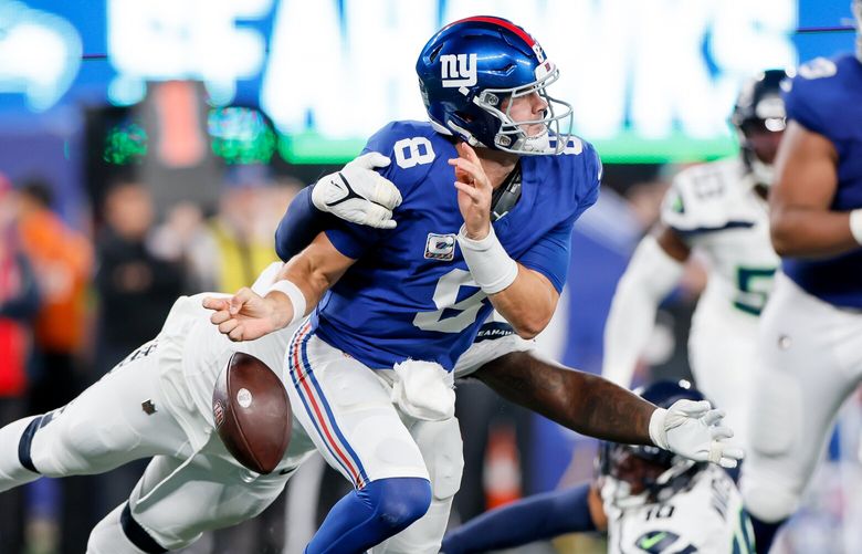 Seattle Seahawks defensive end Mario Edwards Jr. gets to New York Giants quarterback Daniel Jones forcing him to fumble the ball during the first quarter Monday, Oct. 2, 2023 in East Rutherford, NJ. 225107