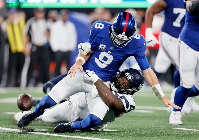 Seattle Seahawks defensive end Mario Edwards Jr. gets to New York Giants quarterback Daniel Jones forcing him to fumble the ball during the first quarter Monday, Oct. 2, 2023 in East Rutherford, NJ. (Jennifer Buchanan / The Seattle Times)