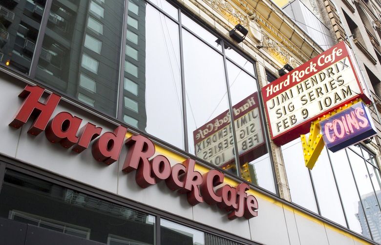 A sign advertises the Jimi Hendrix Signature Series Edition launch event at the Hard Rock Cafe Seattle in Seattle Thursday Feb. 9, 2012, which will feature merchandise with artwork by Alan Aldridge on t-shirts and pins. Fifteen percent of the sales of the merchandise will benefit the Fender Music Foundation and the Jimi Hendrix Park Foundation. The artwork for the guitar began as a collaboration of artist Alan Aldridge and Jimi Hendrix in 1970. (Stephen Brashear/AP Images for Hard Rock)