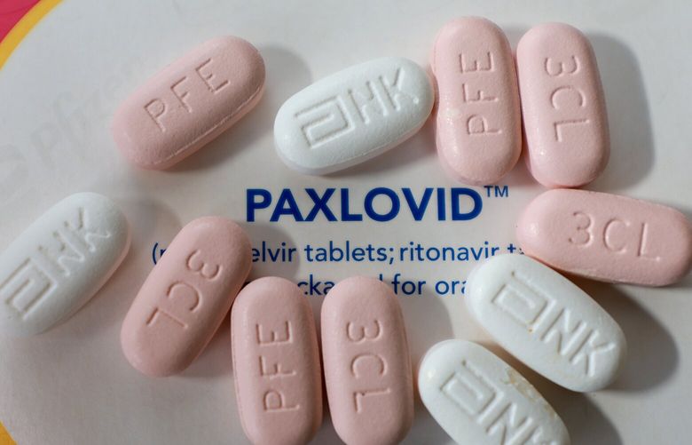 In this photo illustration, Pfizer’s Paxlovid is displayed on July 07, 2022, in Pembroke Pines, Fla. (Joe Raedle/Getty Images/TNS)