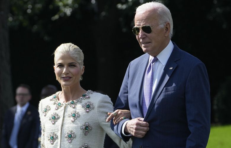 President Joe Biden walks with actress Selma Blair and Blair’s service dog Scout as they arrive for an event to celebrate the Americans with Disabilities Act on the South Lawn of the White House, Monday, Oct. 2, 2023, in Washington. (AP Photo/Susan Walsh) DCSW406 DCSW406
