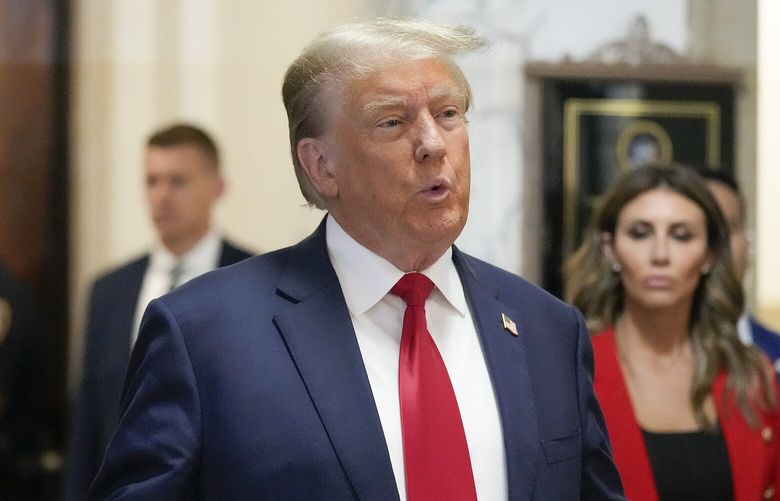 Former President Donald Trump speaks to the media before entering the courtroom at New York Supreme Court, Tuesday, Oct. 3, 2023, in New York. (AP Photo/Seth Wenig) NYJJ306 NYJJ306