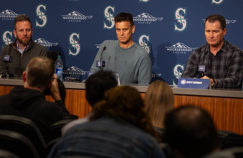 From left, Exec. VP and General Manager of Baseball Operations Justin Hollander; Mariners President of Baseball Operations Jerry Dipoto; and Manager Scott Servais appear together at a news conference after the team did not make it to the post-season, Tuesday, in Seattle. (Ken Lambert / The Seattle Times)
