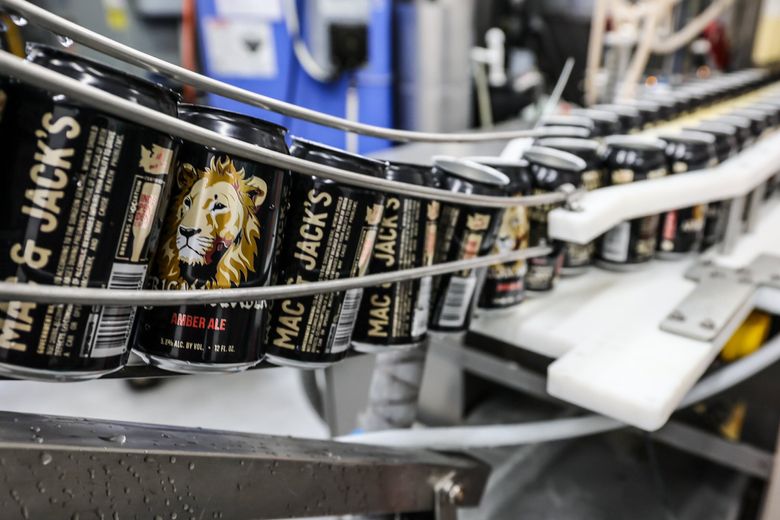 The canning process at Mac & Jack’s Brewing Company in Redmond. The brewery has been sold to Seattle-based Ackley Brands. (Kevin Clark / The Seattle Times)