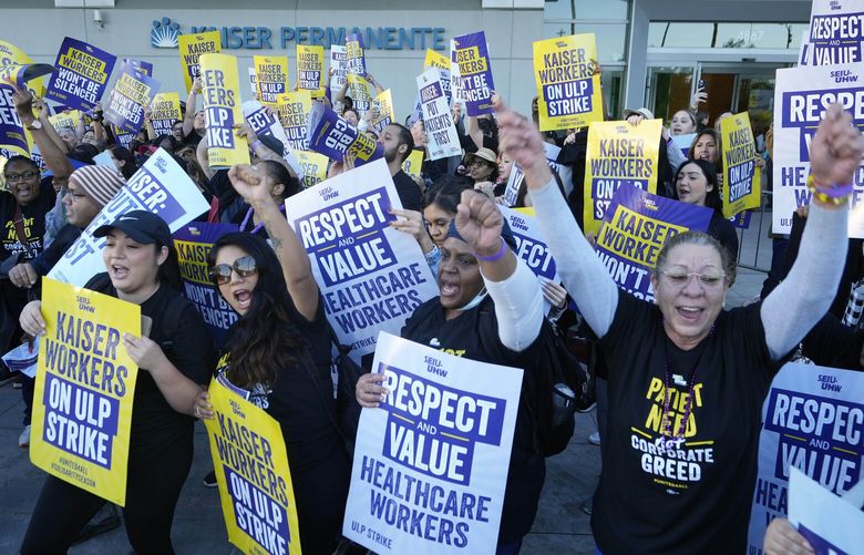 Kaiser Permanente healthcare workers rally outside Kaiser Permanente Los Angeles Medical Center in Los Angeles on Wednesday, Oct. 4, 2023. Some 75,000 Kaiser Permanente hospital employees who say understaffing is hurting patient care walked off the job Wednesday in five states and the District of Columbia, kicking off a major health care worker strike. (AP Photo/Damian Dovarganes) LA353 LA353