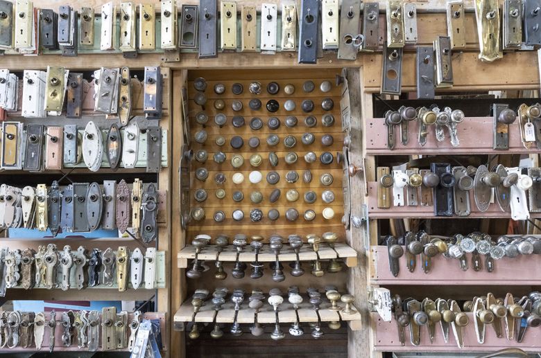 Seattle is home to multiple salvage contractors, who remove valuable and vintage materials from buildings being demolished or remodeled. This hardware is on display at Earthwise Architectural Salvage’s Sodo store. (Ellen M. Banner / The Seattle Times)