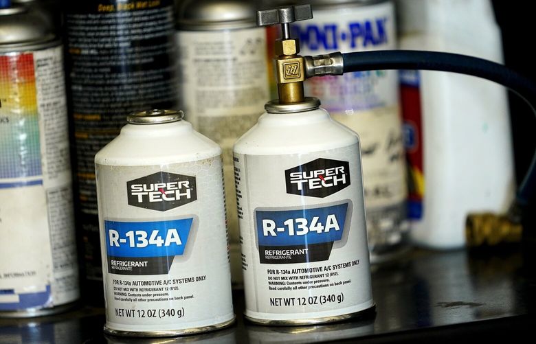 Cans of R-134A refrigerant sit on the shelves of Cary’s Auto, Monday, Aug. 28, 2023, in Scottsdale, Ariz. Refrigerants absorb a lot more heat than water or other common fluids, which makes them great for cooling systems, but bad for climate change when they escape. (AP Photo/Matt York) CLI601 CLI601