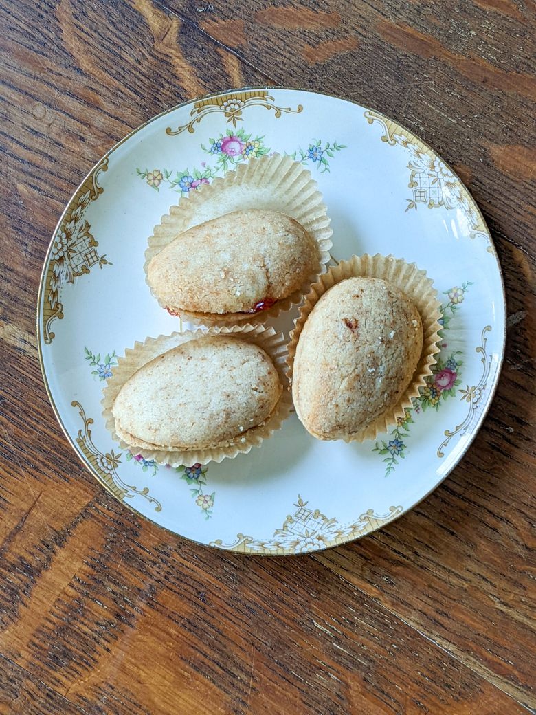 J.M. Enos of Lark forms perfectly oval spoon cookies with richly browned butter and Bonne Maman apricot jam. (Jill Lightner)