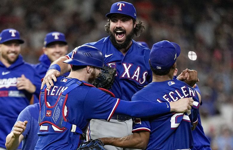 The Texas Rangers celebrate after Game 7 of the baseball AL Championship Series against the Houston Astros Monday, Oct. 23, 2023, in Houston. The Rangers won 11-4 to win the series 4-3. (AP Photo/David J. Phillip) TXMG228 TXMG228