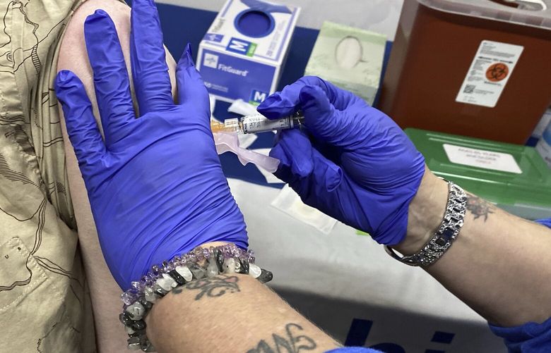 Andy Torres receives his flu shot from Carrie Askew during the Lehigh Valley Health Network walk-in flu shot clinic at Hayden Family Center for the Arts on Friday, Oct. 6, 2023, in Hazleton, PA.(John Haeger Standard Speaker via AP)/\ PAHAZ102 PAHAZ102