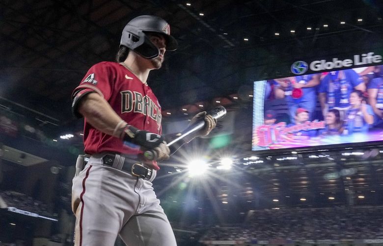 Arizona Diamondbacks’ Corbin Carroll walks to the plate during the fifth inning in Game 1 of the baseball World Series against the Texas Rangers Friday, Oct. 27, 2023, in Arlington, Texas. (AP Photo/Brynn Anderson) WS332 WS332