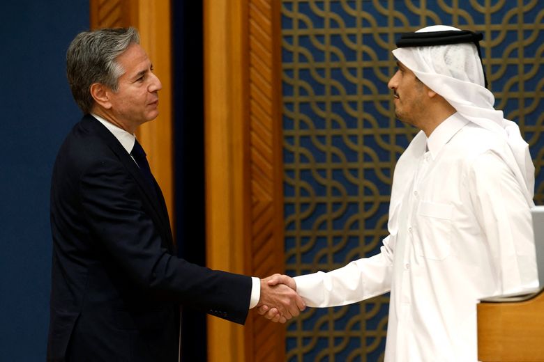 U.S. Secretary of State Antony Blinken, left, shakes hands with Qatar’s Prime Minister and Foreign Minister Mohammed bin Abdulrahman Al Thani following their meeting and news conference in Doha on Friday, Oct. 13, 2023. (Karim Jaafar/AFP/Getty Images North America/TNS)