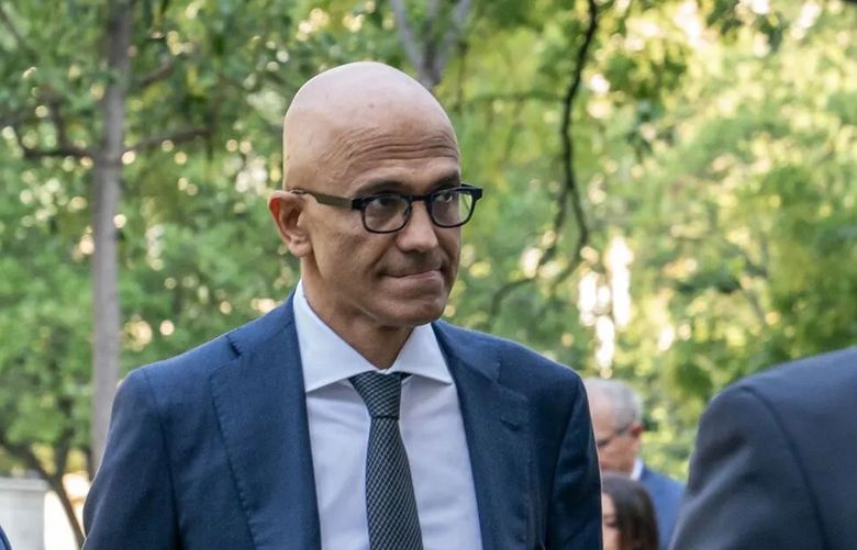 Satya Nadella, center, arrives to federal court in Washington, on Oct. 2. Nadella testified Google could accelerate its current lead by using its massive profits to make its new AI-based search better than rivals. (Nathan Howard / Bloomberg)