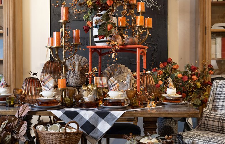 This tablescape nods to Halloween while celebrating autumn. (TNS)