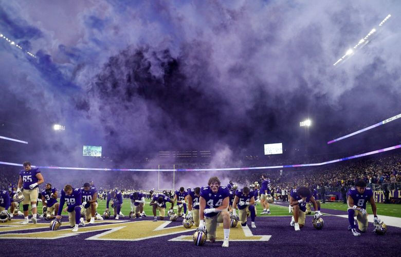 How many fans are at the College Football Playoff Game tonight?