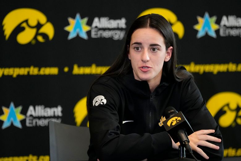 Iowa guard Caitlin Clark speaks to reporters during Iowa&#8217;s NCAA college basketball media day Oct. 4, 2023, in Iowa City, Iowa. Clark is embracing her role as an ambassador for the game after she led Iowa to the NCAA championship game last season. She enters this season with 90 straight double-figure scoring games and a 27.3-point career average. (AP Photo/Charlie Neibergall)