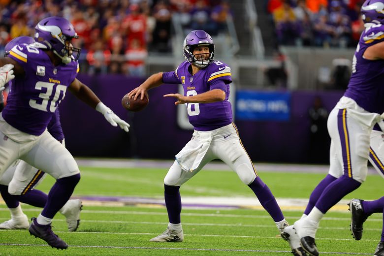 Justin Jefferson of the Minnesota Vikings catches a pass in front