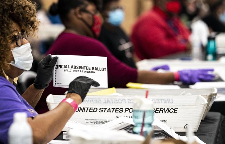Ballots are processed at the Elections Preparation Center at State Farm Arena in Atlanta on Nov. 3, 2020.