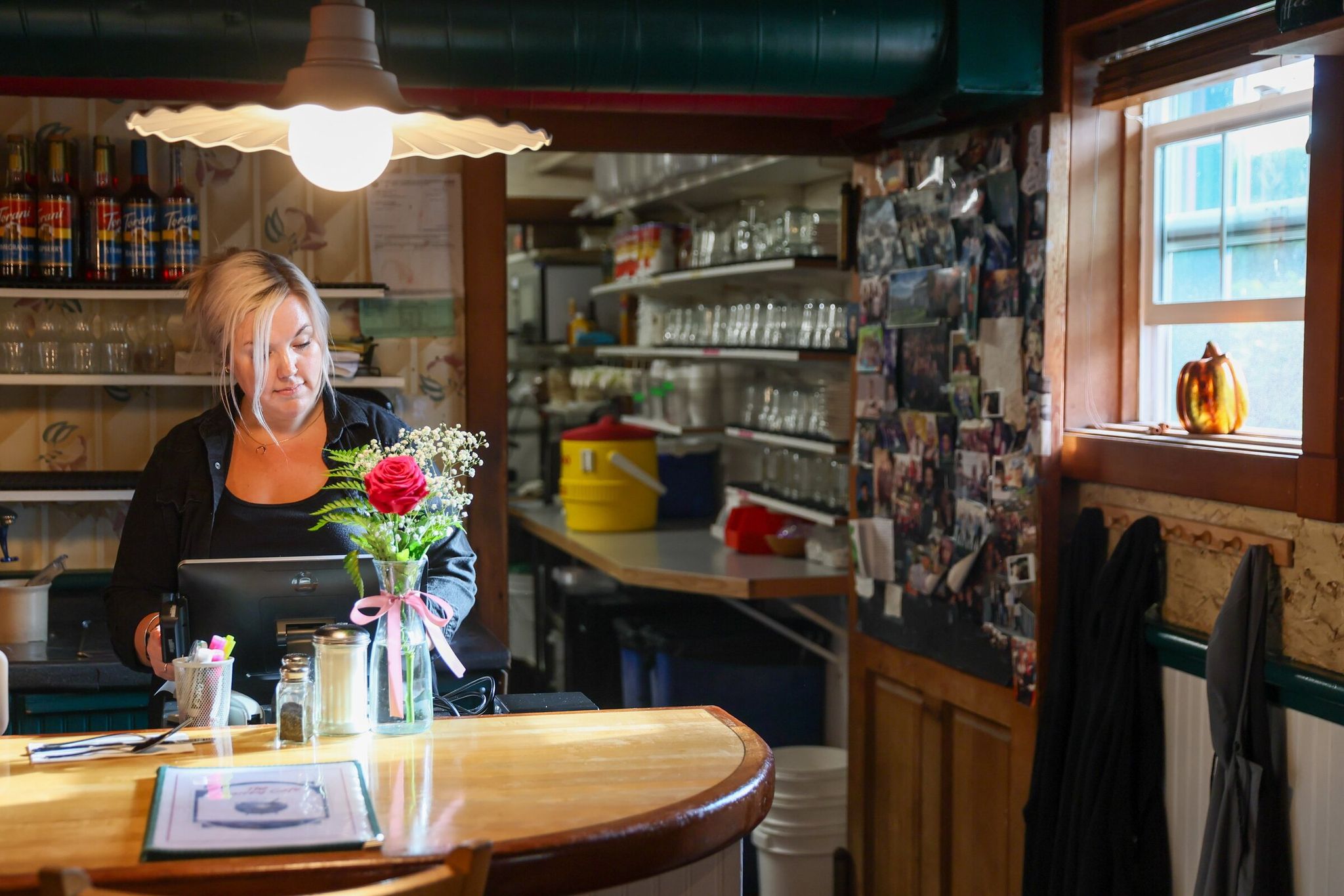 Bria Kooy uses a server station one November morning at the Maltby Cafe. (Kevin Clark / The Seattle Times)