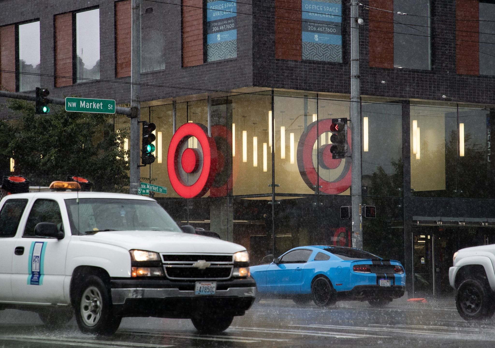 A photo of the Target store in Ballard with cars driving on the street in front of it