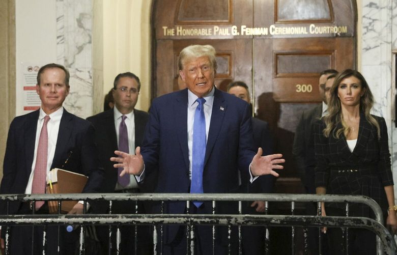 FILE – Former President Donald Trump speaks to reporters after testifying in his civil fraud trial at the State Supreme Court building in Manhattan, Monday, Nov. 6, 2023. A New York appeals court judge on Thursday, Nov. 16, 2023, paused gag orders on Trump and his lawyers that had prevented them from commenting on court staff in the civil fraud trial of the former president. (Jefferson Siegel/The New York Times) XNYT0122 XNYT0122