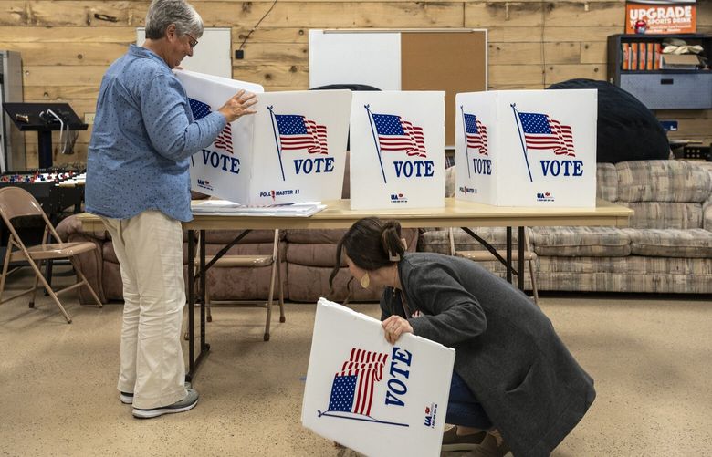 FILE – Election workers begin to dismantle a polling place after closing on Election Day, Nov. 7, 2023, in Pella, Iowa. Voting rights leaders have viewed the current conservative makeup of the Supreme Court as hostile to the Voting Rights Act. (Jordan Gale/The New York Times) XNYT0968 XNYT0968