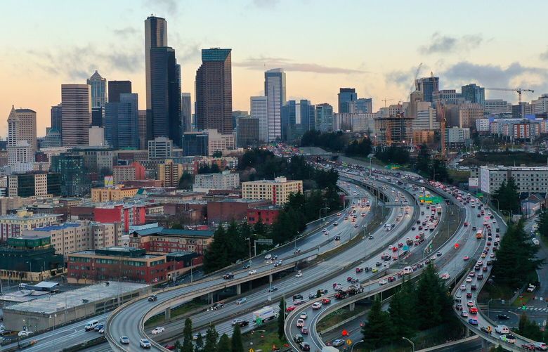 Traffic heads north during morning rush hour where I-90 meets I-5 on Wednesday, March 15, 2023. Hump Day” takes on new meaning post pandemic, as Wednesday becomes the most congested point of the workweek. New data from late 2022 show a massive change in commute habits, as most downtown employees work at home Mondays and Fridays and go in-person midweeks.