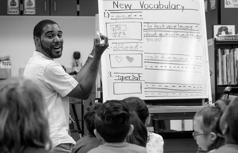 Kyle Jackson goes over a vocabulary lesson with his kindergarten class at Rising Star Elementary School in Seattle’s Beacon Hill neighborhood.