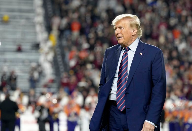 Donald Trump draws cheers, some boos in Haley's backyard at Clemson-South  Carolina football game | The Seattle Times