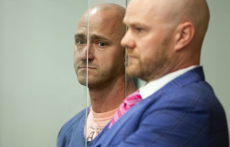 Joseph David Emerson, left, 44, was arraigned in Multnomah County Circuit Court on Tues., Oct. 24, 2023, in Portland. Ore. Emerson, a pilot, is accused of attempting to disable the engines of a plane on which he was riding while off-duty. (Dave Killen/The Oregonian via AP, Pool) 