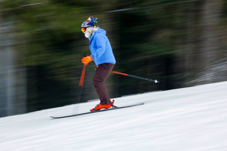 A skier blurs through a run at Crystal Mountain, which has the most bells and whistles of any ski area in Washington. Prefer a scruffier ski hill? We have you covered in this guide to 10 of the best Cascade ski hills in the Northwest. (Jennifer Buchanan / The Seattle Times)