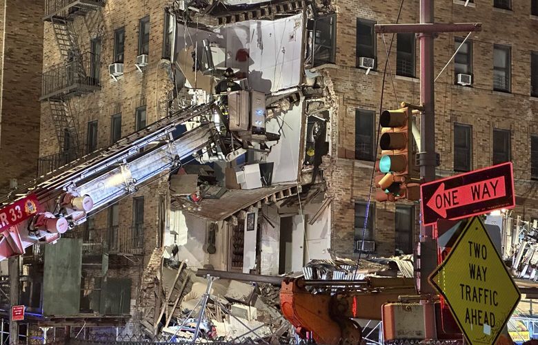 Firefighters continue to work the scene where a six-story corner of a Bronx apartment building collapsed, Monday, Dec. 11, 2023, in New York. (AP Photo/Joseph B. Frederick) NYJF102 NYJF102