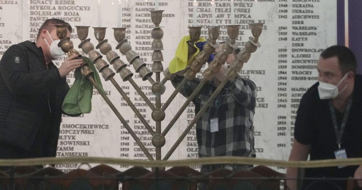 Farright lawmaker extinguishes Hanukkah candles in Polish parliament