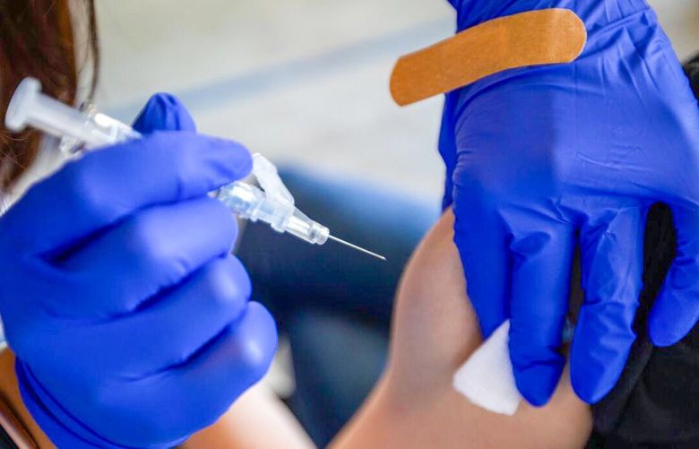 A nurse gives a COVID-19 vaccine at Kaiser Permanente, Oct. 12, 2023, in Pasadena, California. 97473987P