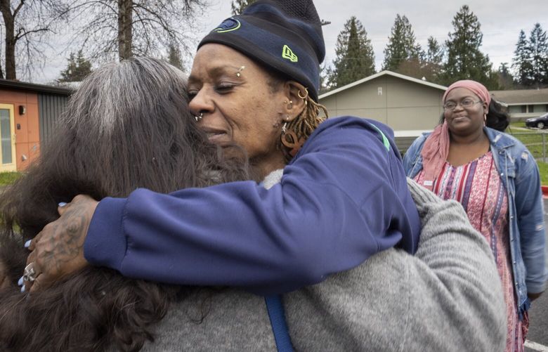 Valerie Brown hugs Amanda Knutson, (l) community engagement manager at Kent Youth and Family Services (KYFS) as Rachel Suggs, site lead at Valli Kee Youth Center, one of KYFS’s after school programs, watches before they, too hug.  The women with KYFS just filled Brown’s trunk with Christmas gifts for her grandchildren.  She said that without KYFS their Christmas would not be as good and she is so indebted to the organization for so many things all year round.   Valerie Brown’s children were involved in several programs at Kent Youth and Family Services and now her grandchildren attend the center’s after-school program. She credits the center with being a supportive space for them and for her as she raised her children as a single mom.

  225707