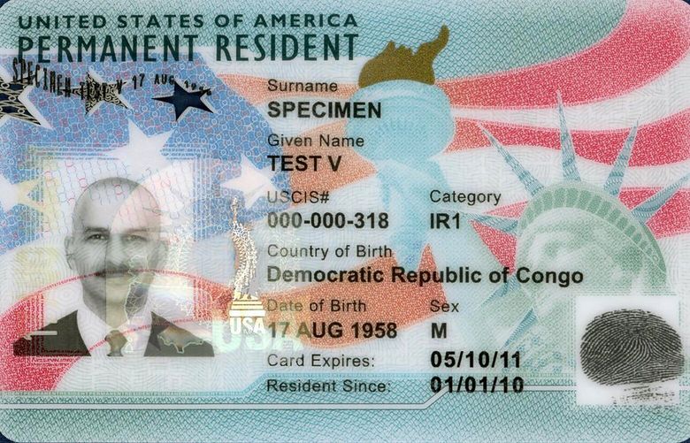 This undated image from the U.S. Citizenship and Immigration Service shows the front of a sample “green card,” formally known as a Permanent Resident Card. President Donald Trump has hinted that he might extend a 60-day hold on green cards for foreign workers that he ordered to protect American jobs during the coronavirus outbreak. Analysts predict the number of green cards issued annually will drop from about 1 million to 300,000 if the changes stand. (USCIS via AP)