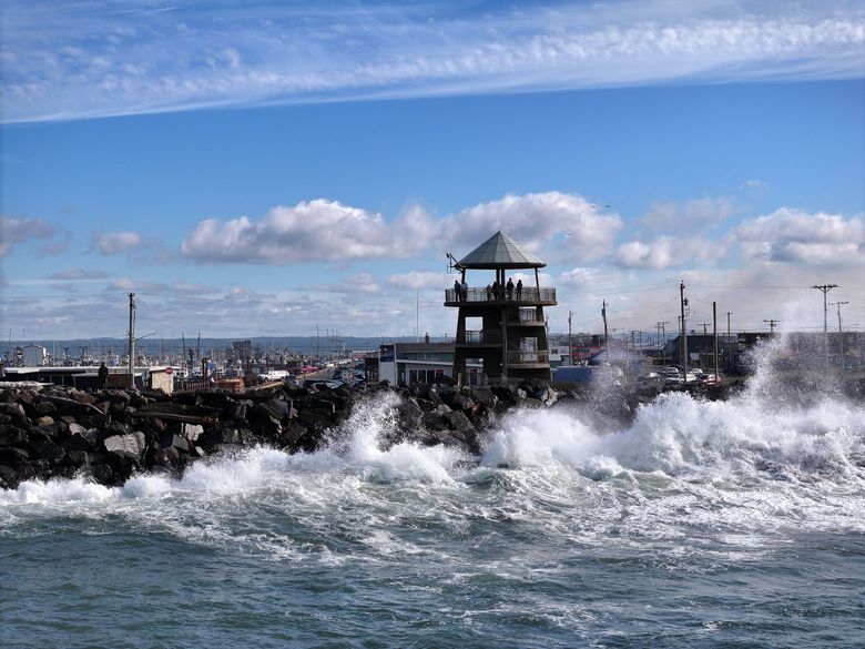 Waves crash into the rock wall at the Port of Grays Harbor Observation Tower in Westport. (Karen Ducey / The Seattle Times)