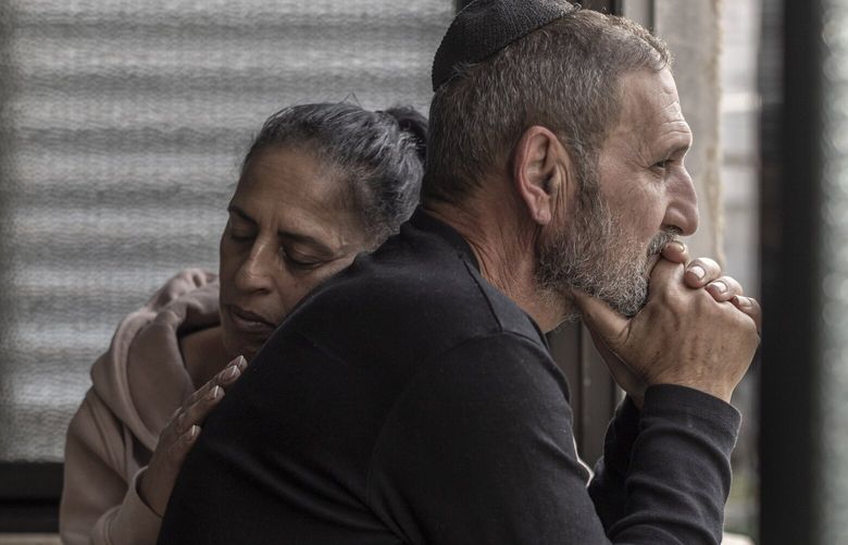 Eti Bracha, 56, and her husband, Eli, 60, the parents of Gal Abdush, who was killed by Hamas on Oct. 7, at their home in Kiryat Ekron, a small town in central Israel, Dec. 7, 2023. A New York Times investigation uncovered new details showing a pattern of rape, mutilation and extreme brutality against women in the attacks on Israel. (Avishag Shaar-Yashuv/The New York Times) XNYT0270 XNYT0270